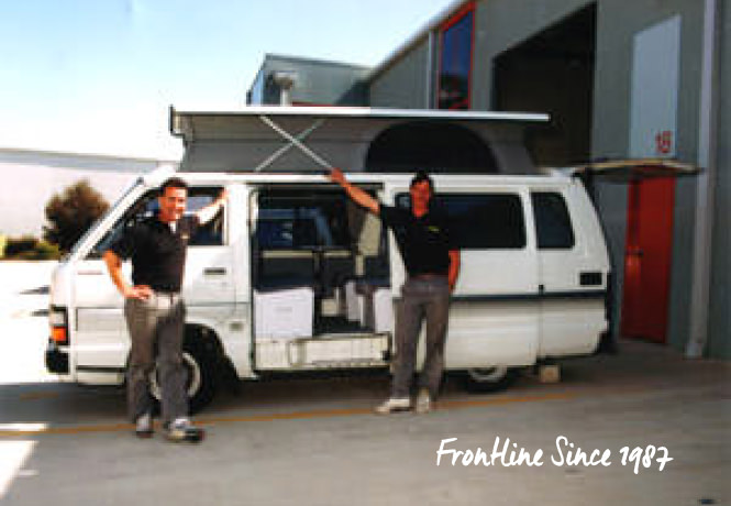 Frontline Camper Conversions Directors standing with Retro Toyota Hiace Campervan 1987